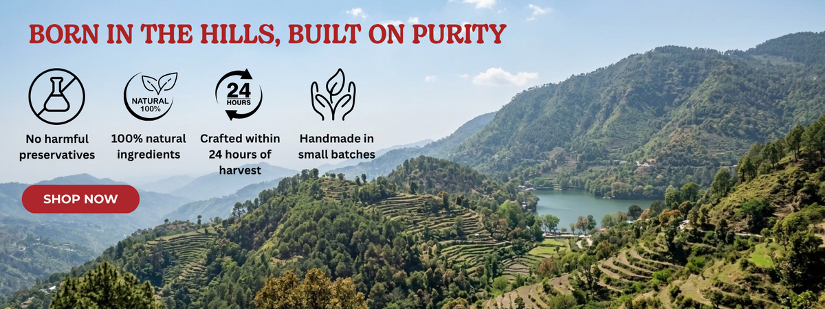 A scenic mountain landscape with terraced green hills, a lake, and blue sky, with promotional text at the top reading 'BORN IN THE HILLS, BUILT ON PURITY' and feature icons plus a red 'SHOP NOW' button.