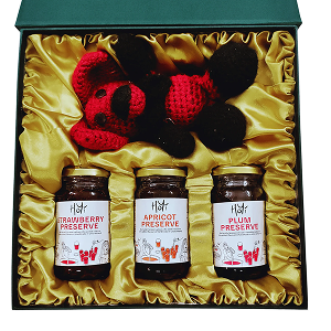 HoYi gift box containing strawberry, apricot, and plum preserves arranged with a handmade teddy in premium packaging