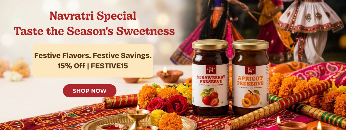 Two jars of Hife Preserves, one Strawberry and one Apricot, displayed on a decorated Navratri table with marigolds, oil lamps, and traditional attire in the background. Promotional text on the left reads 'Navratri Special Taste the Season's Sweetness'.