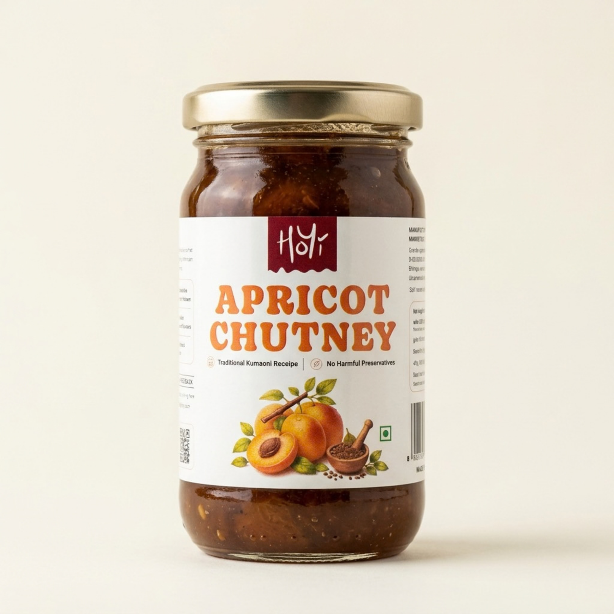 A glass jar of Hdy Apricot Chutney with a gold metal lid and a white label featuring orange text and apricot illustrations, set against a plain off-white background.